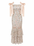 " THE BEADED DRESS "