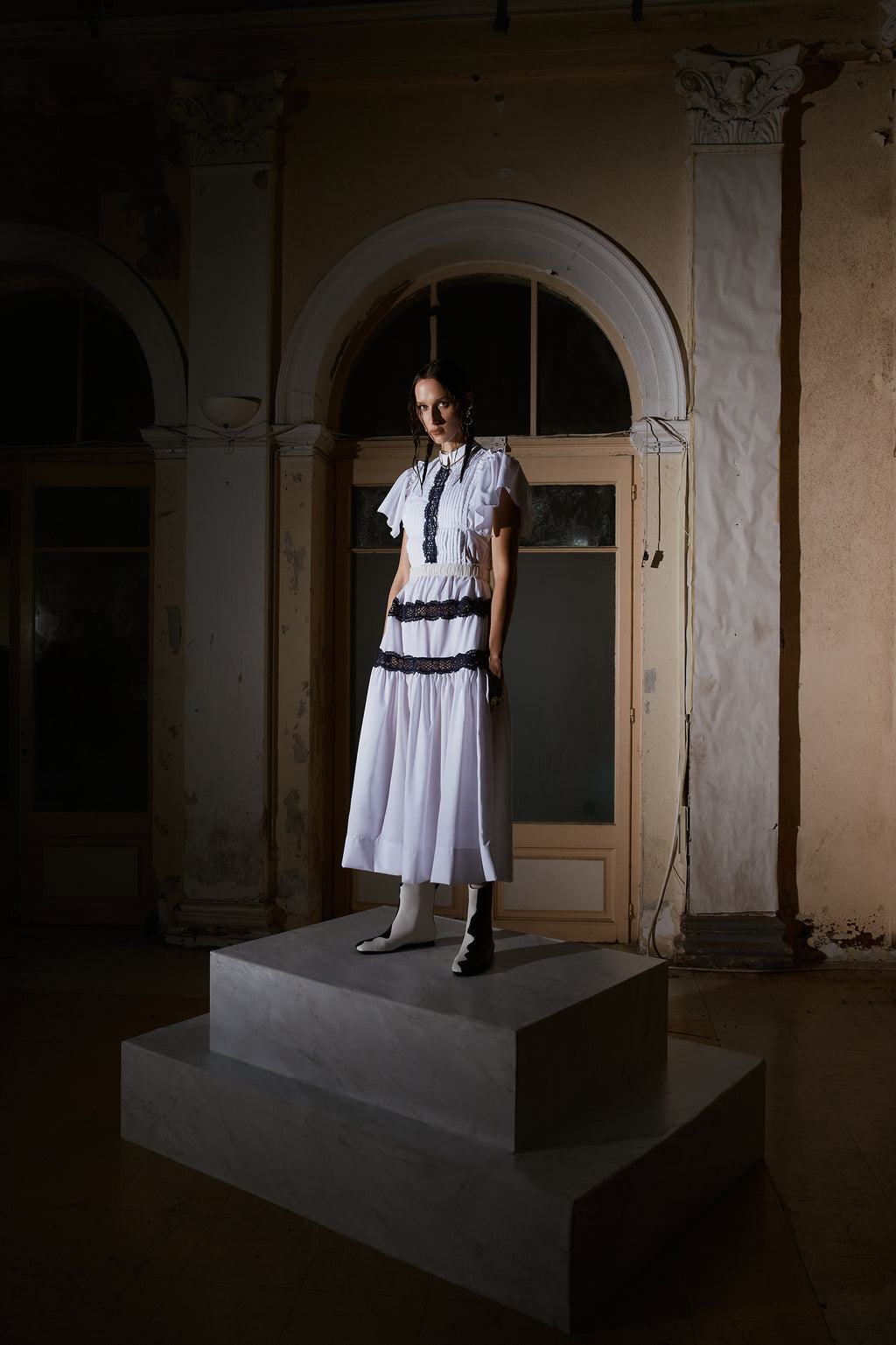 " White flared dress with blue lace"